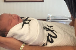 dad holding baby
