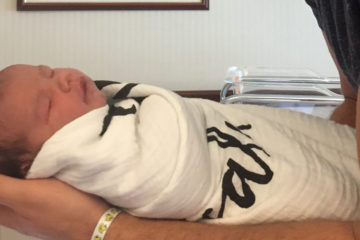 dad holding baby