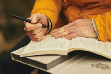 Person writing in journal