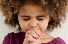 little girl praying