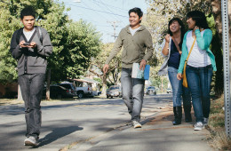 middle schoolers walking down street