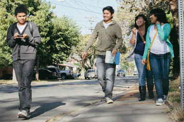 middle schoolers walking down street