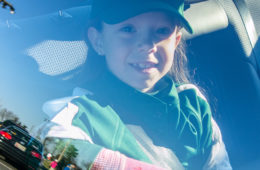 girl riding in car