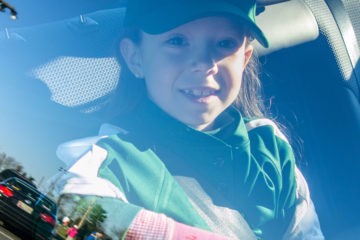 girl riding in car