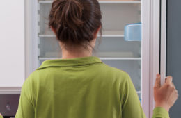 lady looking in fridge